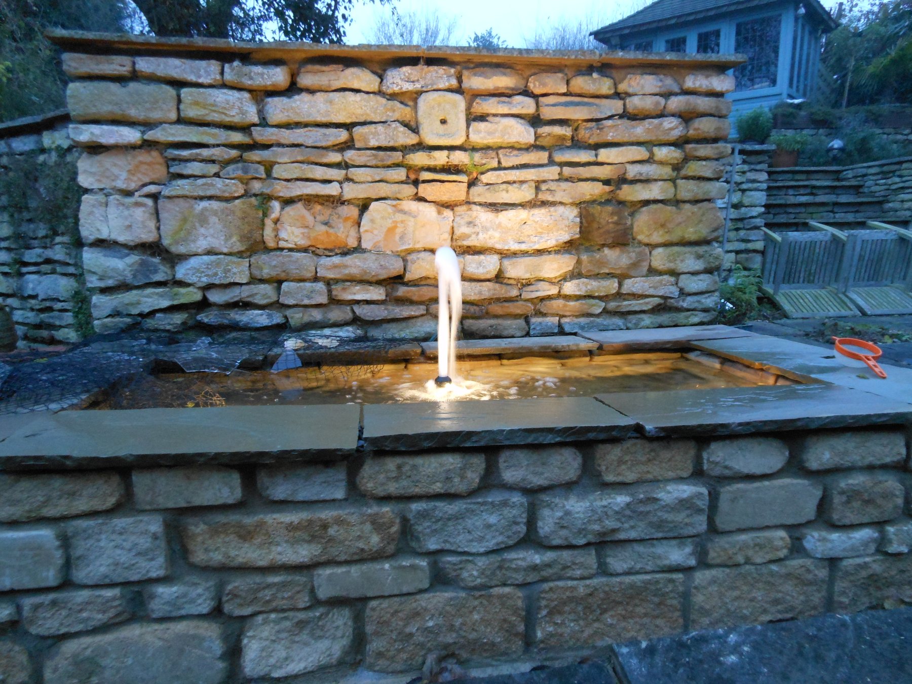 Dry stone water wall with a fountain