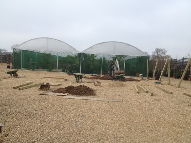 The bare gravel plot beside the nursery polytunnels before the show gardens were built